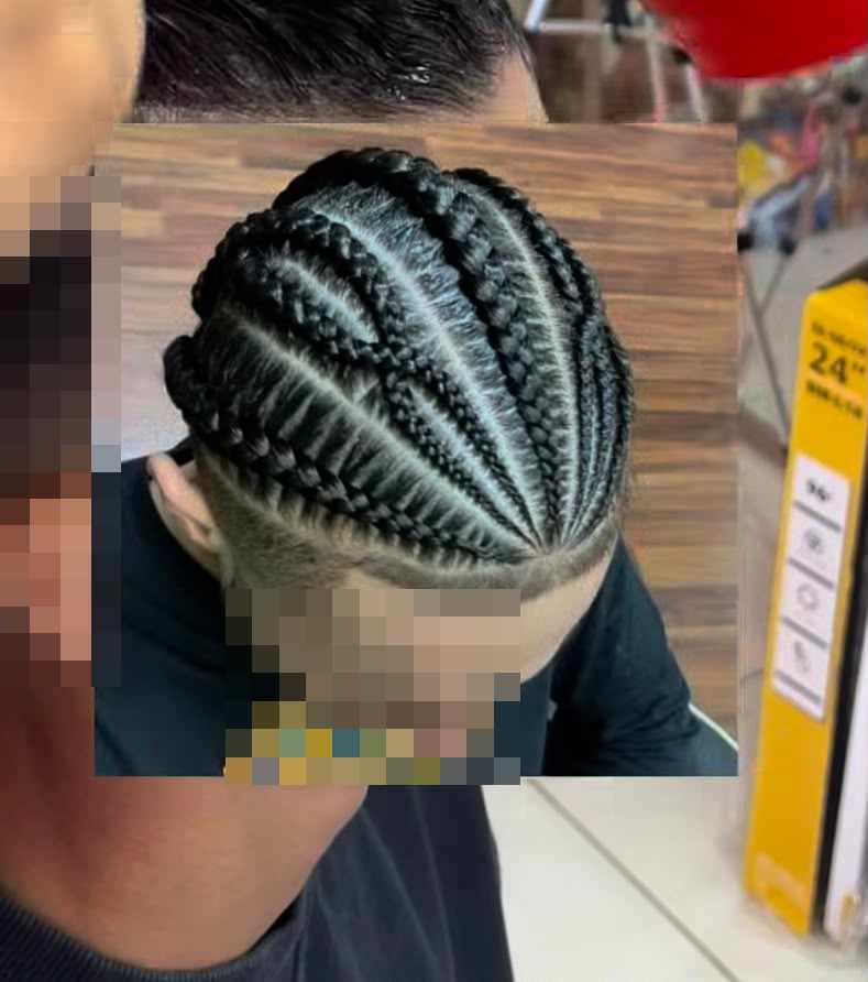 Braids opening outward across the head from a low point at the side