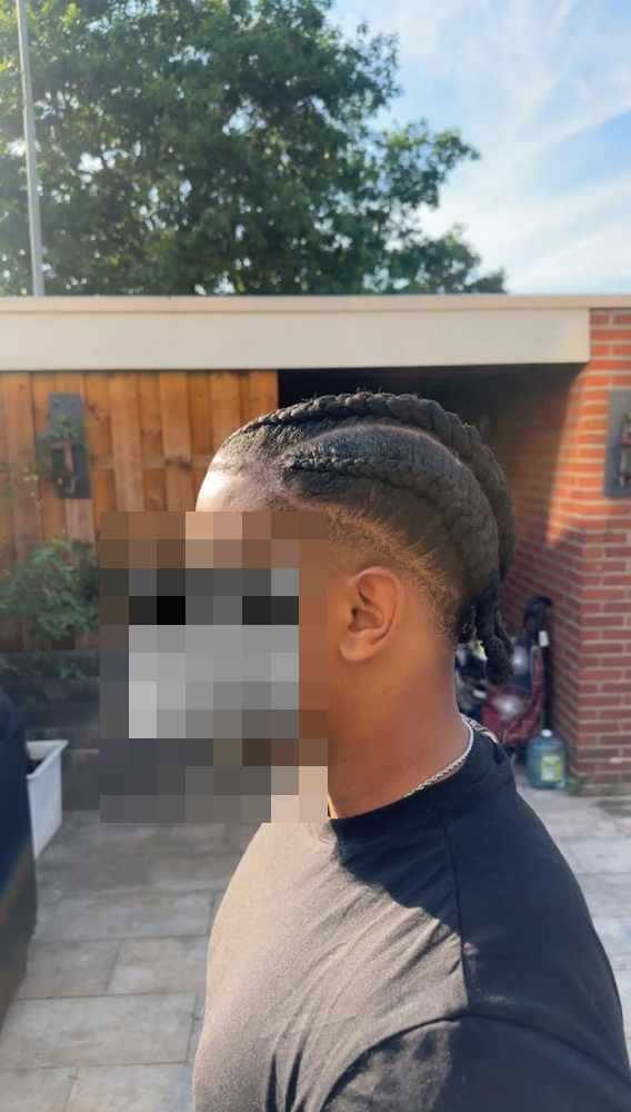 Four thick cornrows, seen from the other side