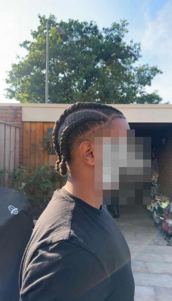 Four thick cornrows, seen from the side
