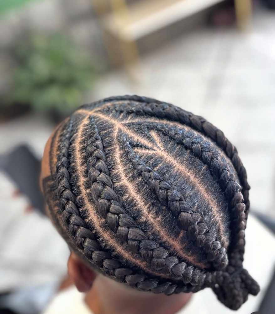 Seen from above: a leaf-shaped panel in the middle where braids fan outward from a single spine
