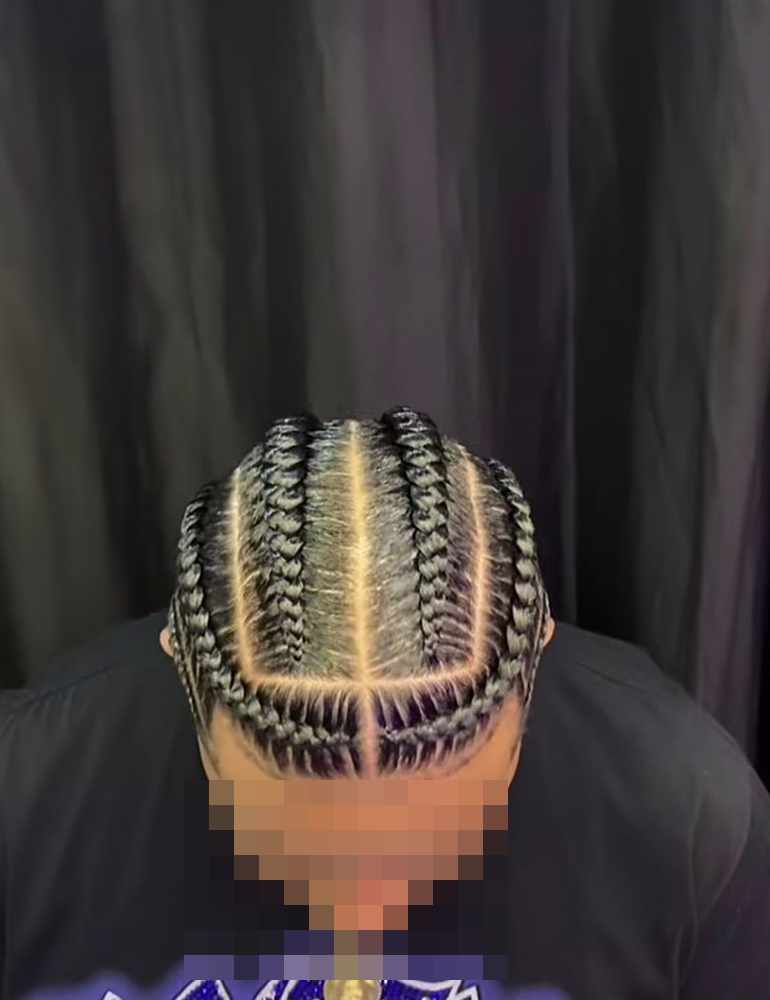 Straight-back cornrows from above: eight braids of equal thickness running straight back